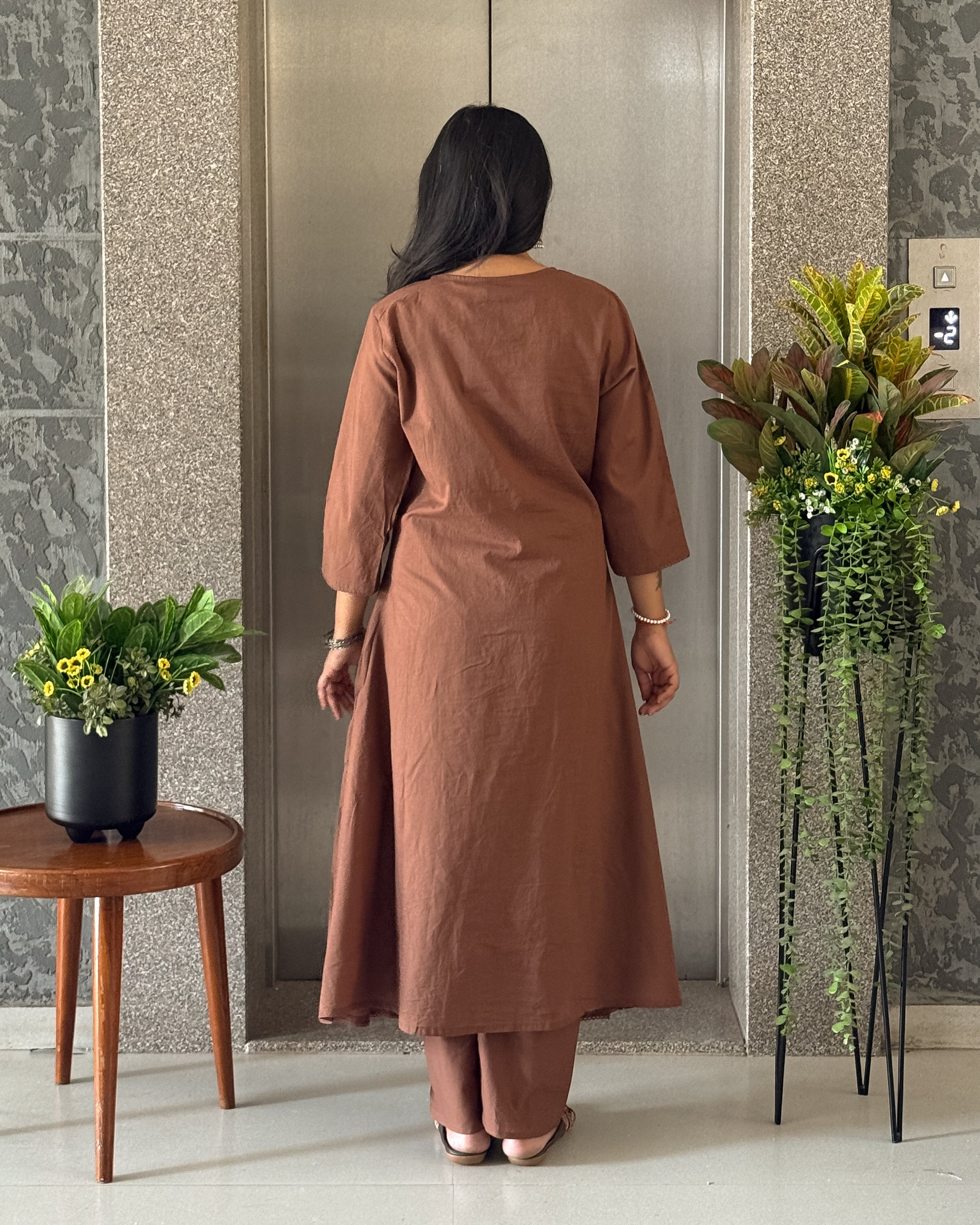 Back View Of Brown Kurta Set.