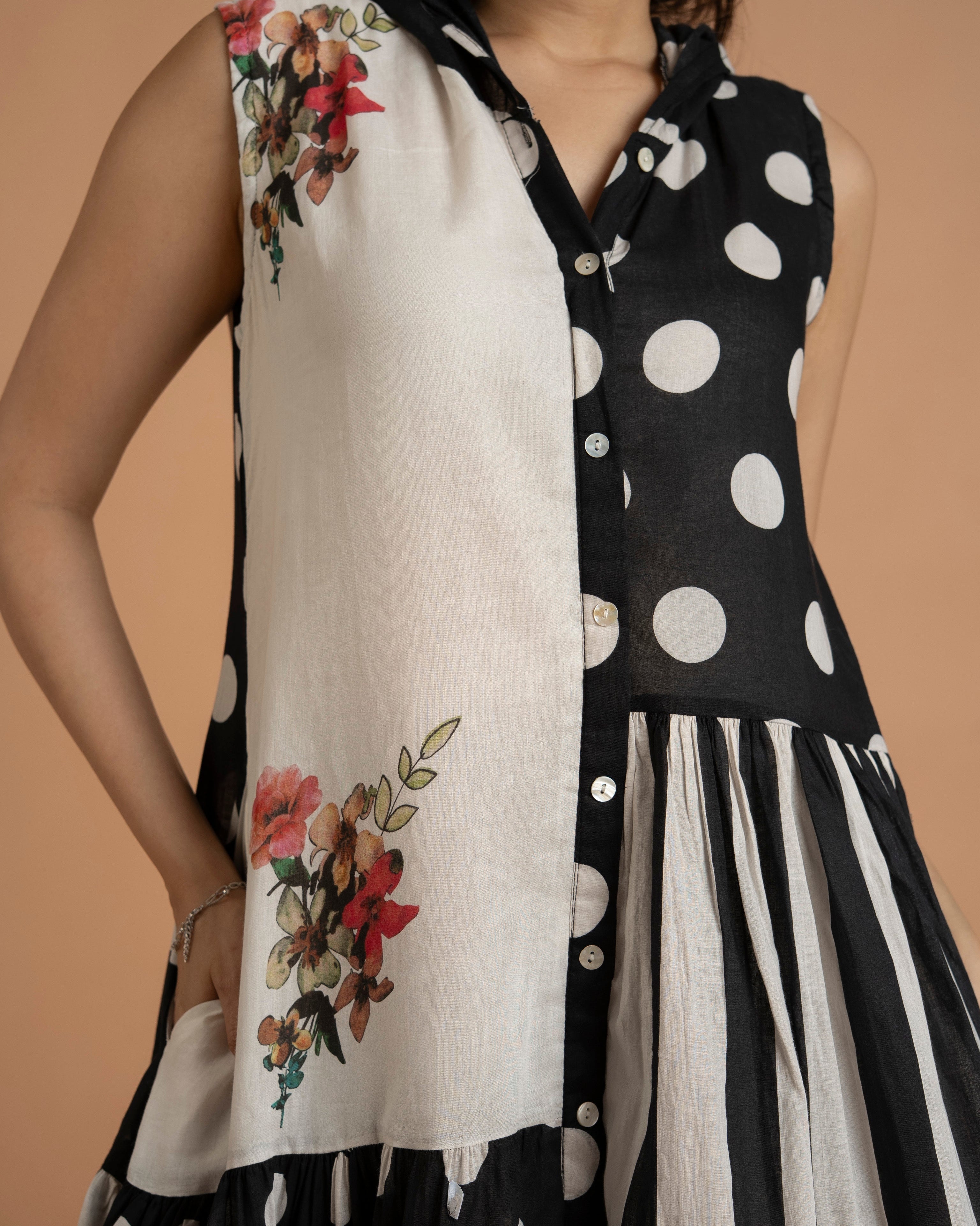 Close-Up View Of Black And White Patchwork Printed Kurta Featuring Floral Print, Polka Dots, And Vertical Stripes.