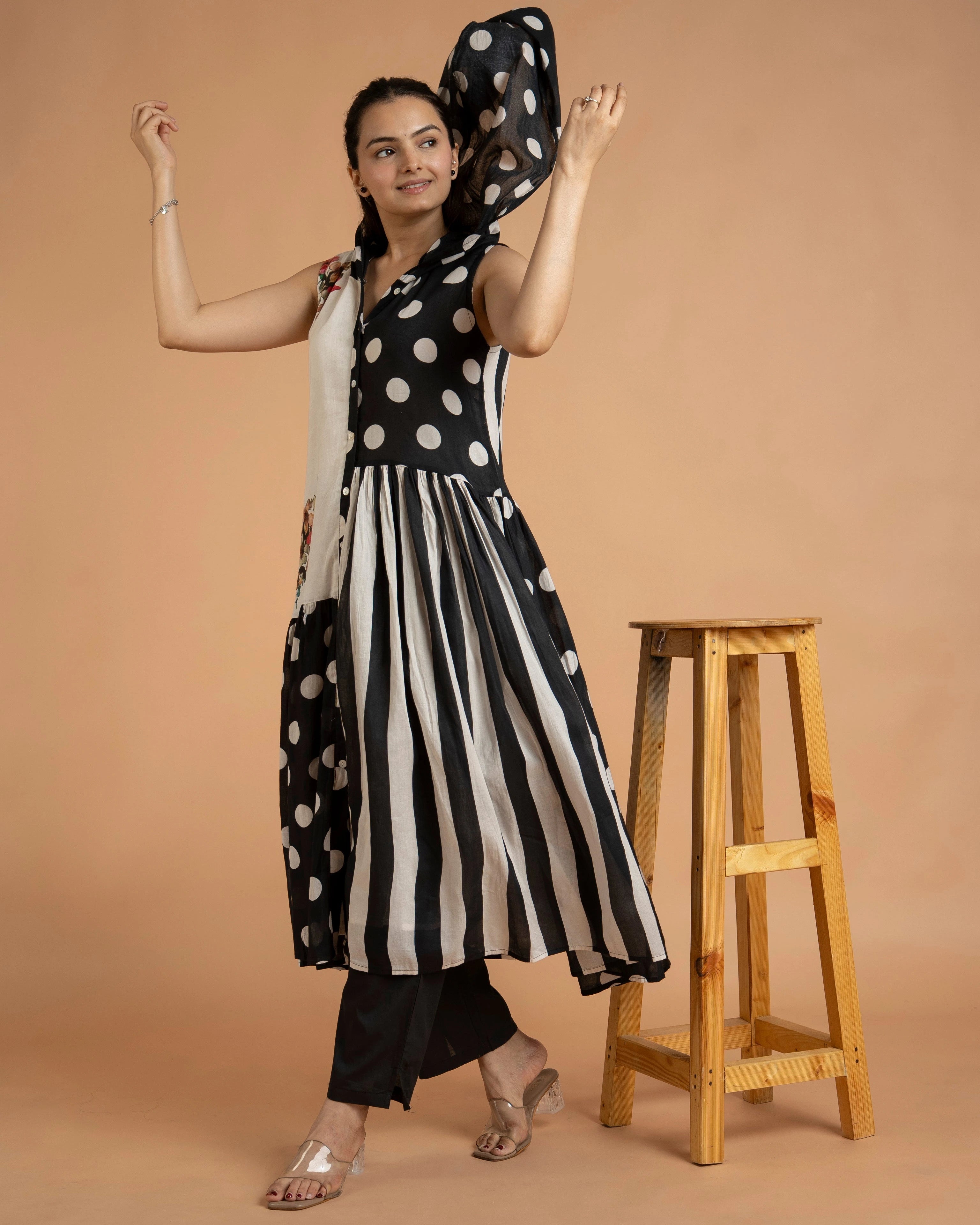 Detailed Close-Up Of Sleeveless Black And White Kurta Showcasing Button Front Design And Premium Fabric Finish.