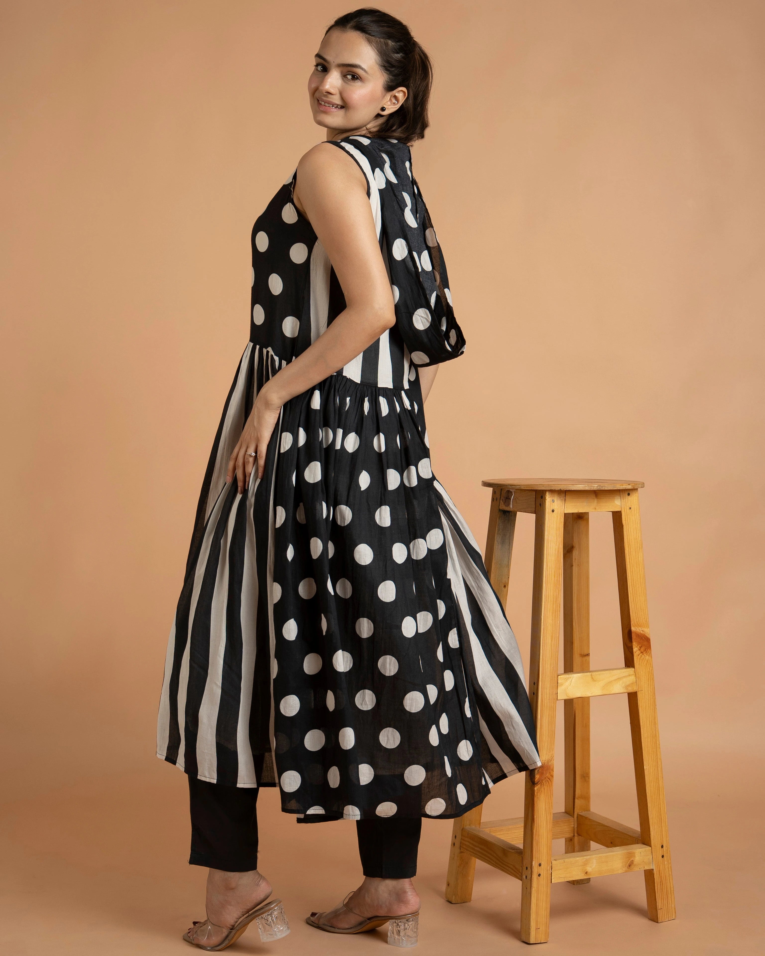 Designer Sleeveless Black And White Kurta Pant Set With Button Down Style And Modern Ethnic Look.
