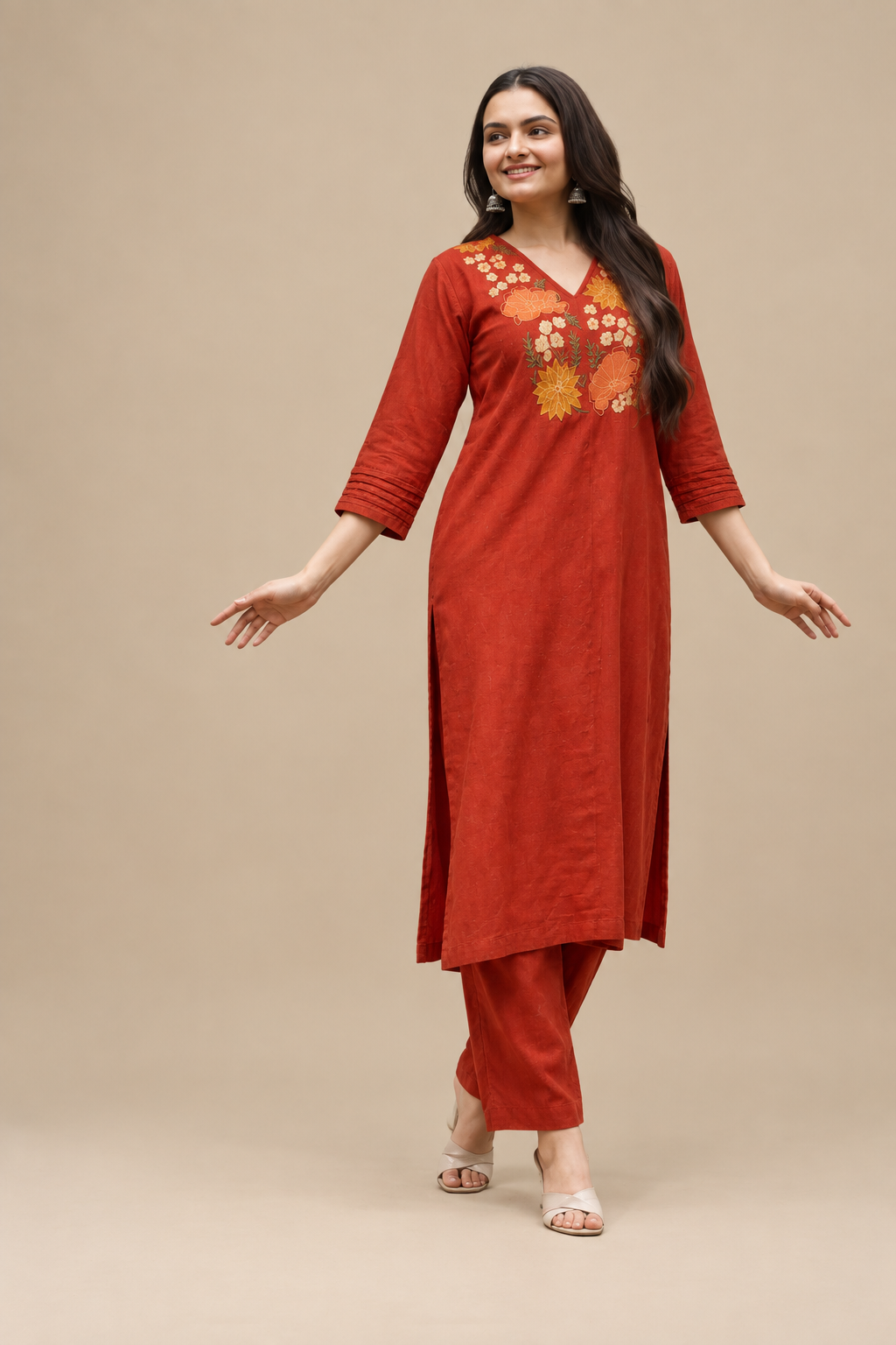 Stylish rust A-line kurta with floral embroidery, bell sleeves, and coordinated palazzo trousers.