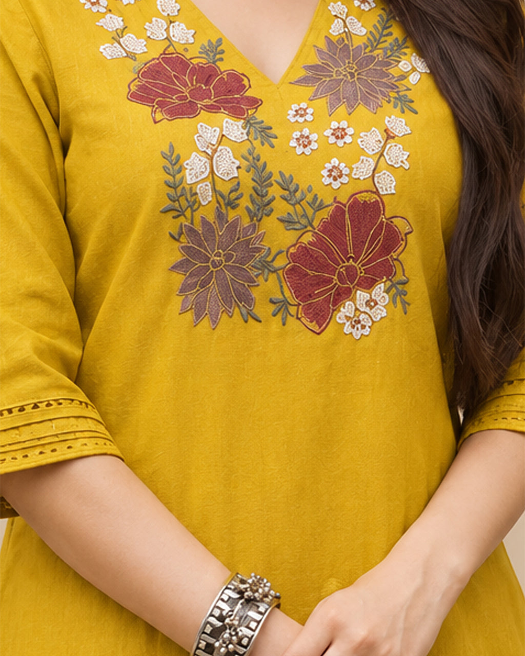 Yellow floral embroidered A-line kurta with matching wide-leg palazzo trousers.