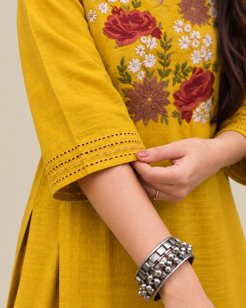 Elegant yellow A-line floral embroidered kurta set with 3/4 sleeves and palazzo pants.