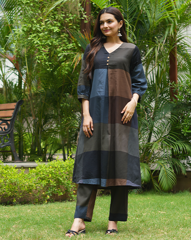 Woman wearing a grey color block A-line kurta with matching straight pants